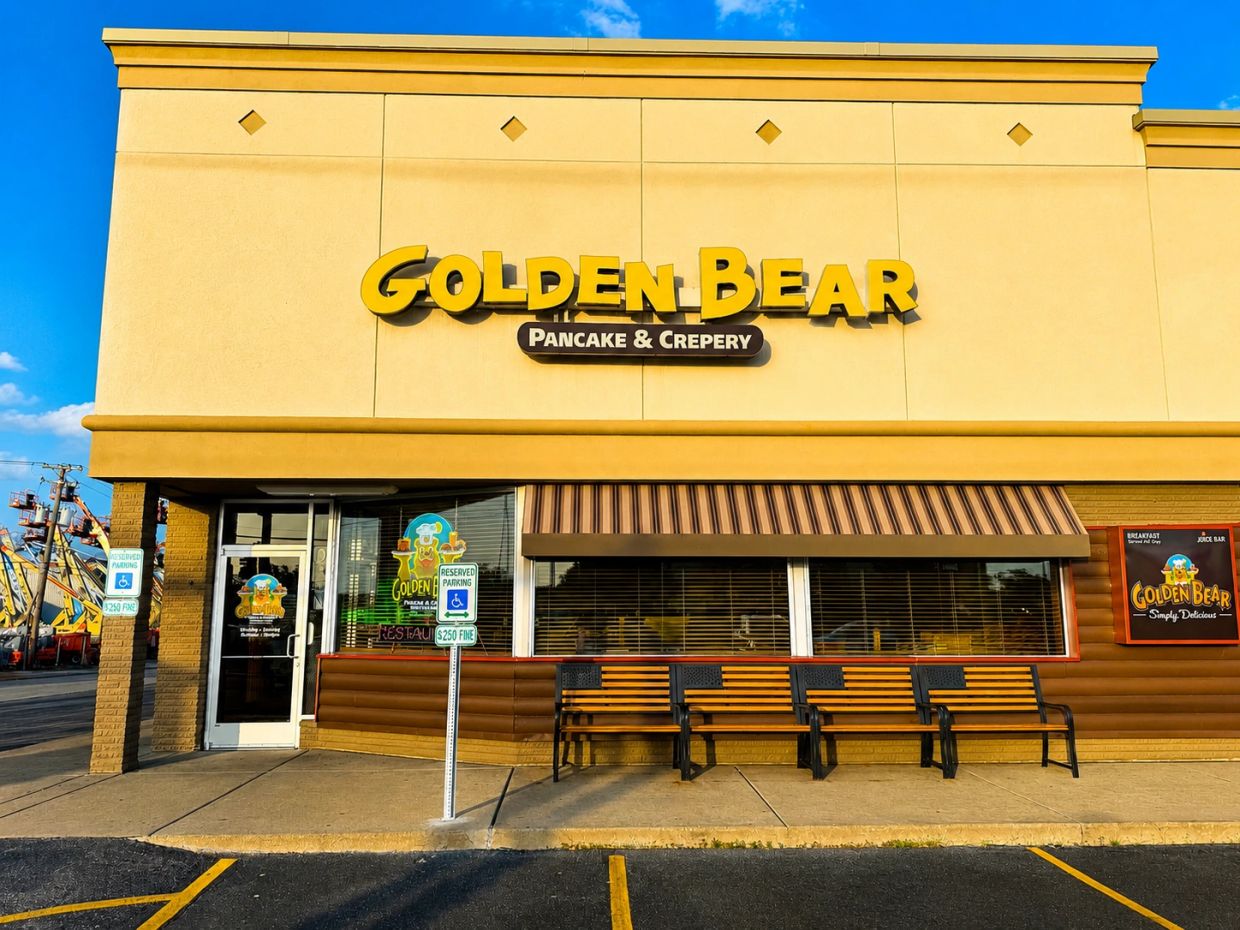 Golden Bear Pancake &amp; Crepery restaurant exterior with benches.