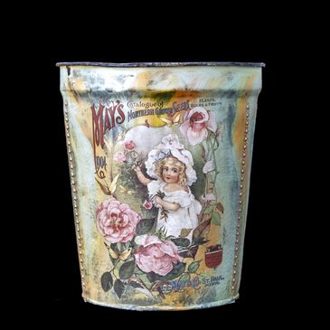 Vintage metal bucket with floral and child illustration.
