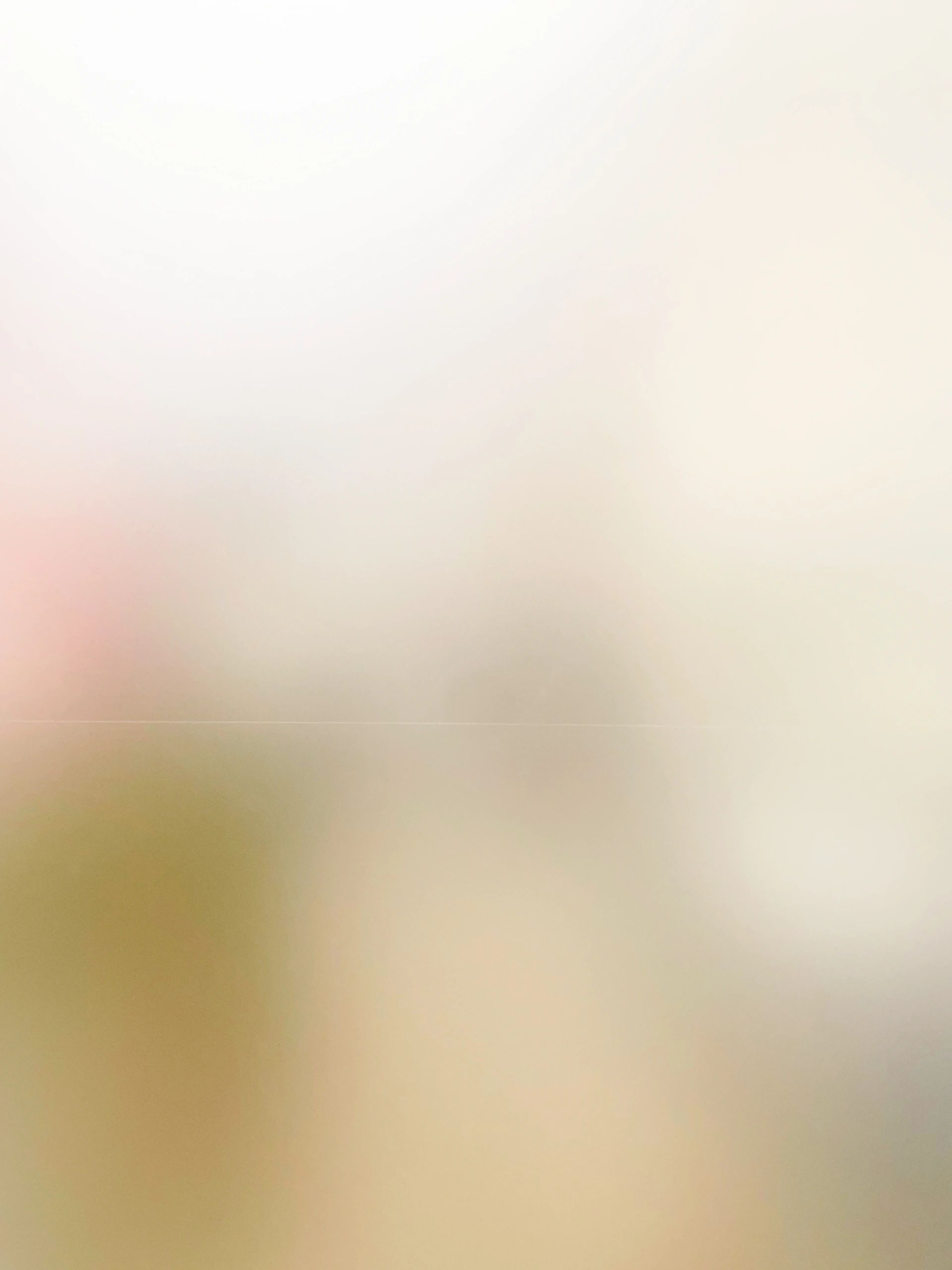A blurry image with indistinct colors and shapes.