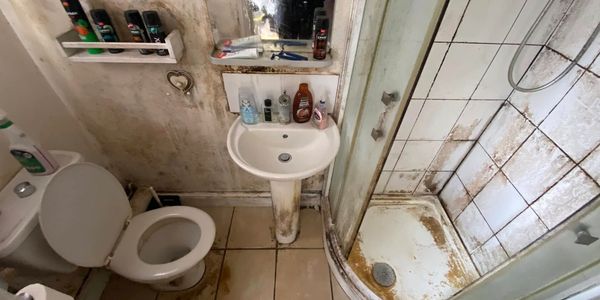 white bathroom with heavy mould. mould removal. specialist cleaning. deep cleaning. Canterbury