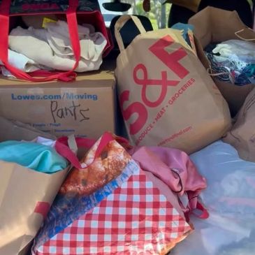 Bags and boxes filled with clothes and groceries.