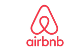 Logo Airbnb rouge stylisé.