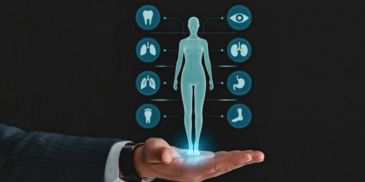 Hand holding a holographic human body with health icons.
