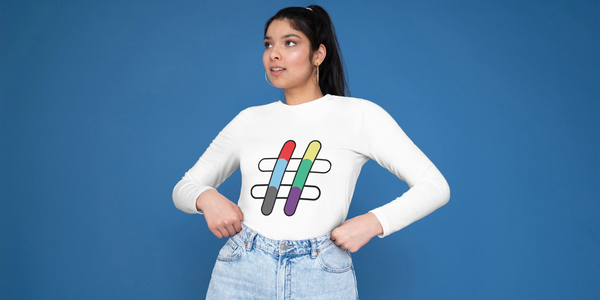 A young woman stands with her hands on her hips, she is wearing a top with the IMatter hashtag icon.