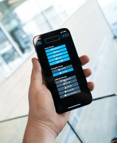 Hand holding a smartphone displaying a productivity app interface.