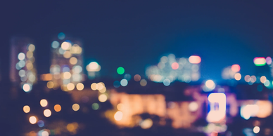Blurred city lights creating a colorful bokeh effect at night.