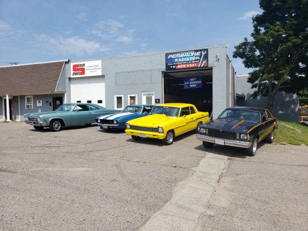Classic cars out front of Pembroke Radiator