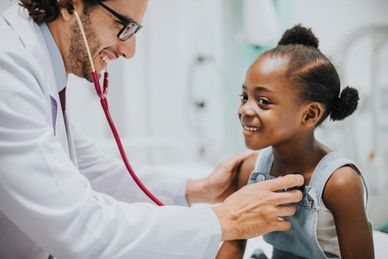 doctor listening to child's heart