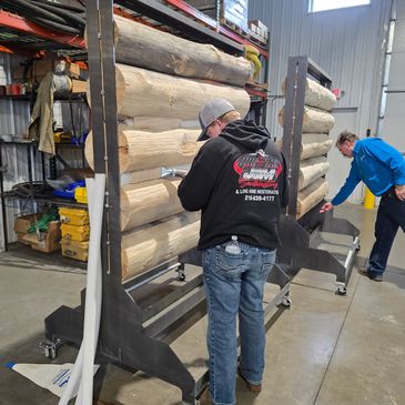 Learning the proper way to apply chinking on logs.