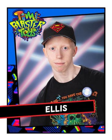Portrait of Ellis wearing a Superman hat.