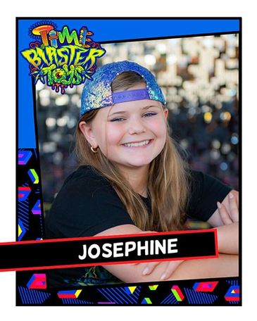 Smiling girl named Josephine in a colorful cap.
