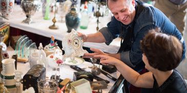 Customers looking at flea market items 