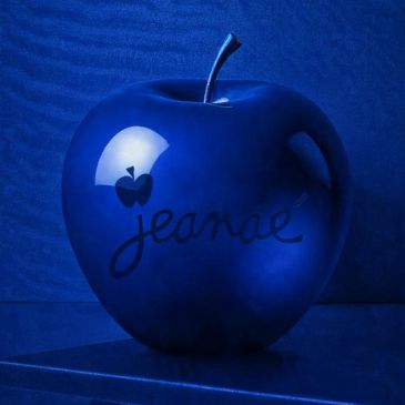 A blue apple with a small apple reflection and the word 'Jeanae' written on it.