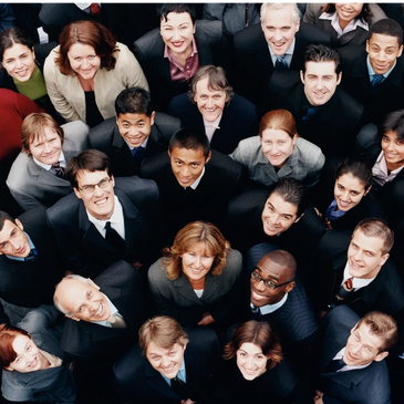 Diverse group of professionals looking upwards, smiling.