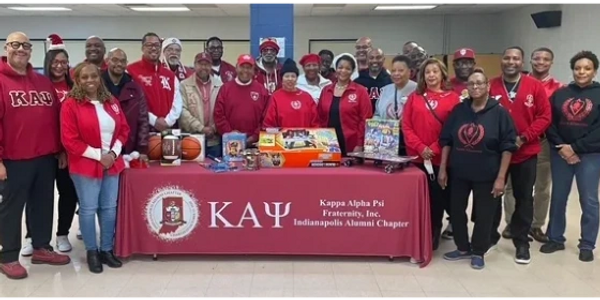 IAC Kappas and the Indianapolis Kappa Silhouettes team up to give toys and more to K-12 graders.
