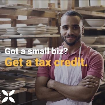 Picture of a small business owner receiving tax credits for offering employee healthcare.