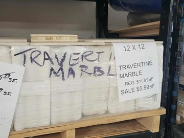 pallet of travertine marble wrapped in plastic