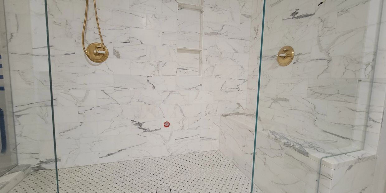 Steam shower tiled with marble