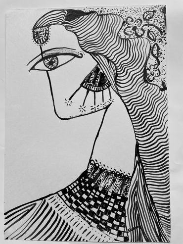 black and white portrait of a woman with ink and pen on paper