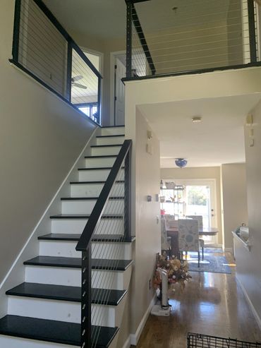 Bottom of stairs city post railing view