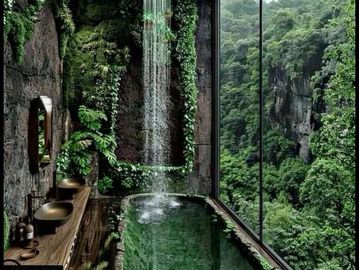 Bathroom with waterfall and forest view.