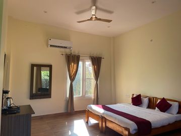 The Deluxe rooms at Karan's Corbett Motel are larger than the standard rooms and offer additional am