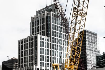 Image of a high rise with RF new code compliance and a crane