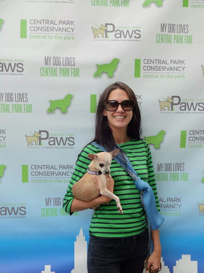 Alexandra holding Daisy, one of her many rescue dogs.