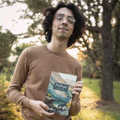 Man holding PrePrayer for the Day book cover option twp.