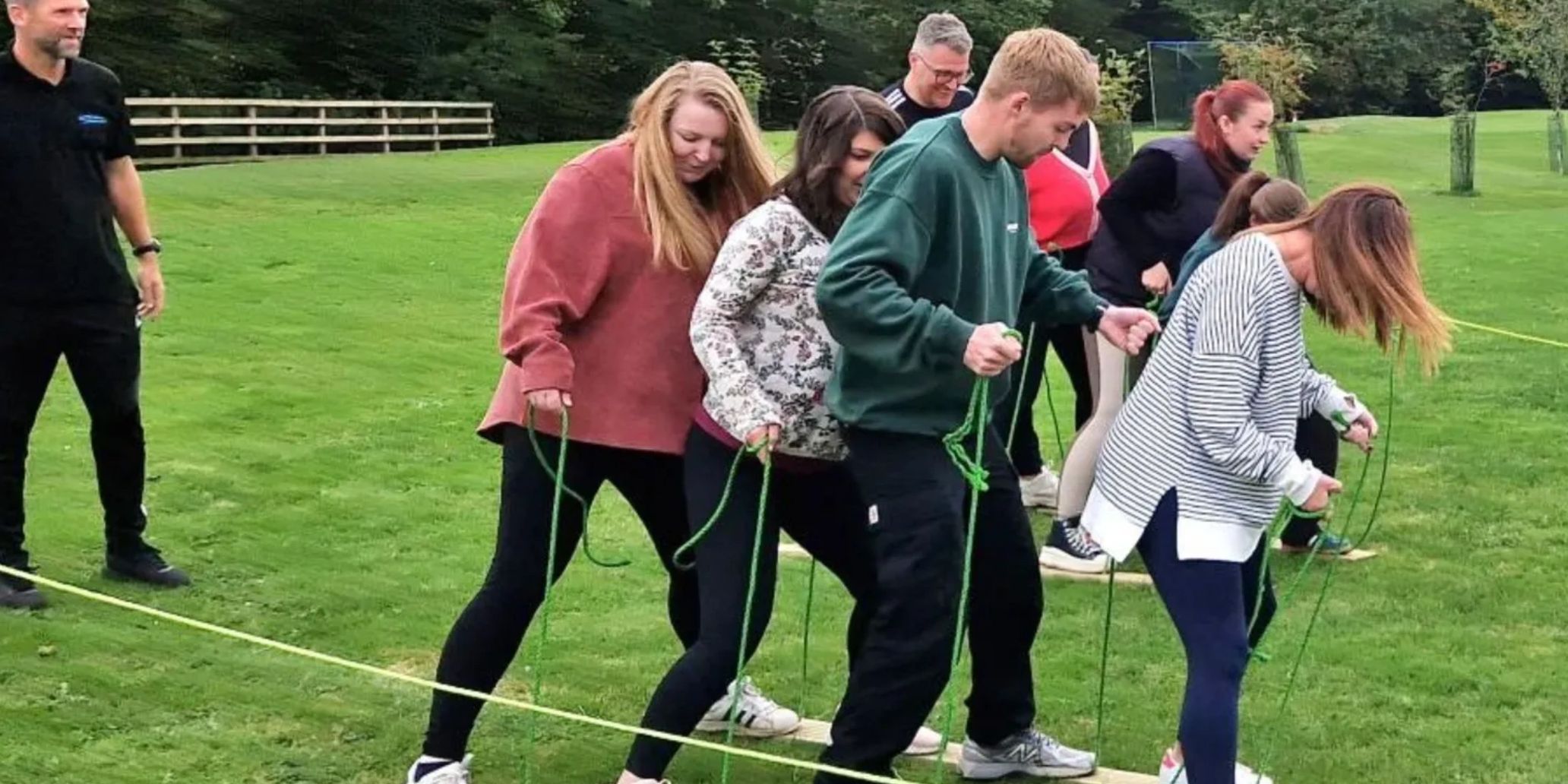 Group of young work colleagues taking part in a team buildiing exercise