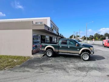 Pickup truck crashed into building corner.