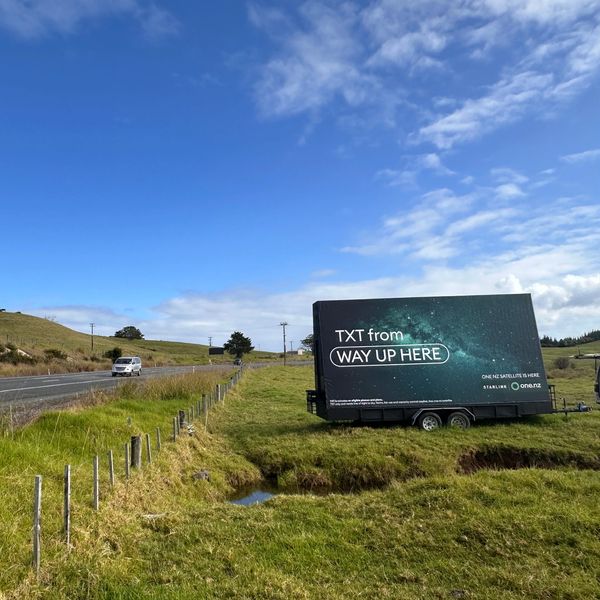 Roadside Reach double-sided mobile billboard advertising One NZ on SH1 at Pakaraka