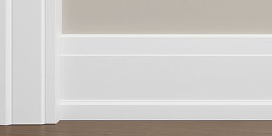 White baseboard on a beige wall.