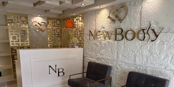 Reception area of New Body wellness center with modern decor.