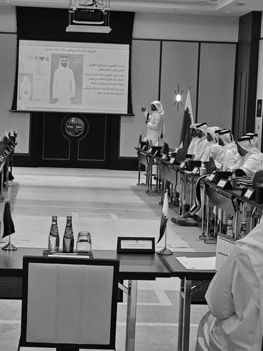 Presentation taking place in a conference room with attendees.