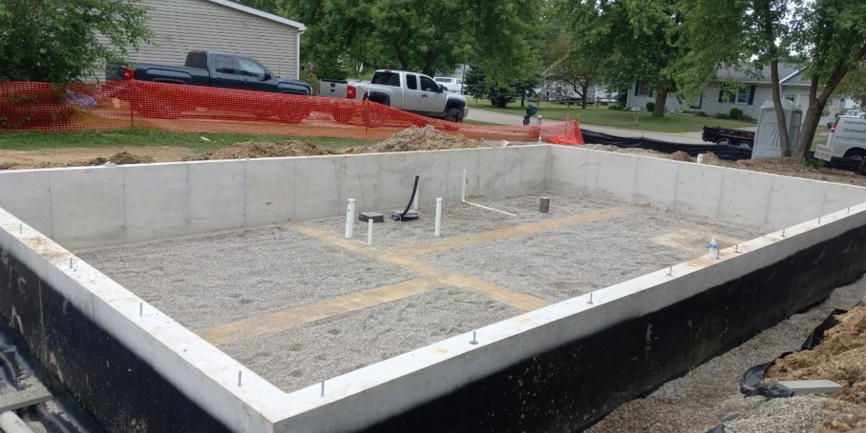 Concrete foundation for a building under construction.