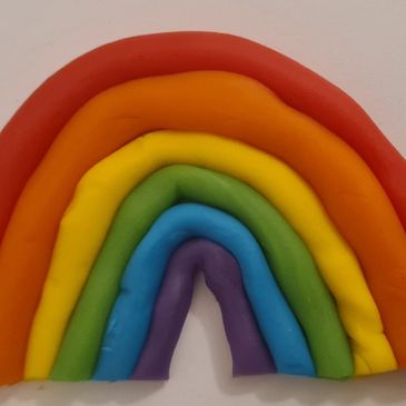 Playdough rainbow, play therapy includes creative and sensory play with play therapist Bundaberg