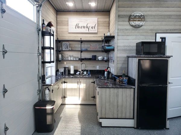 Cozy kitchen corner with rustic wooden cabinets and modern appliances.