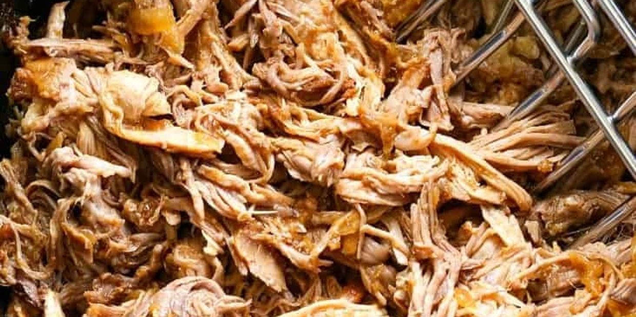 Close-up of tender pulled pork with meat claws.