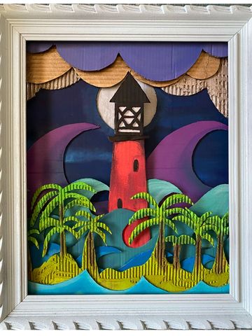 Colorful layered paper lighthouse with palm trees in a white frame.