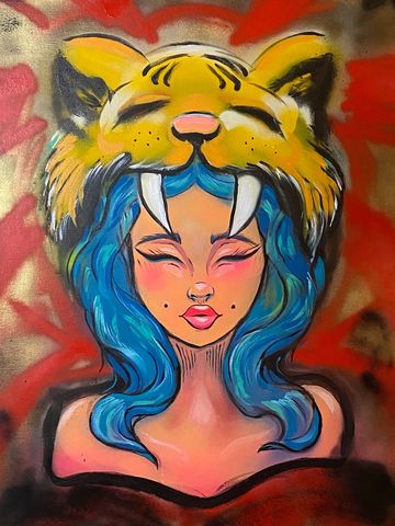 Graffiti of a woman with blue hair wearing a tiger head.