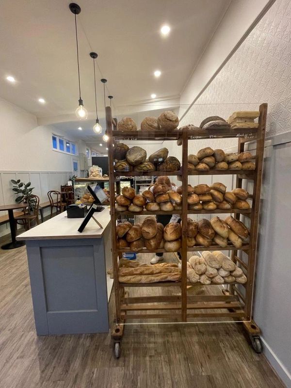 European Bread Rack Filled with Freshly Baked Sourdough Breads 