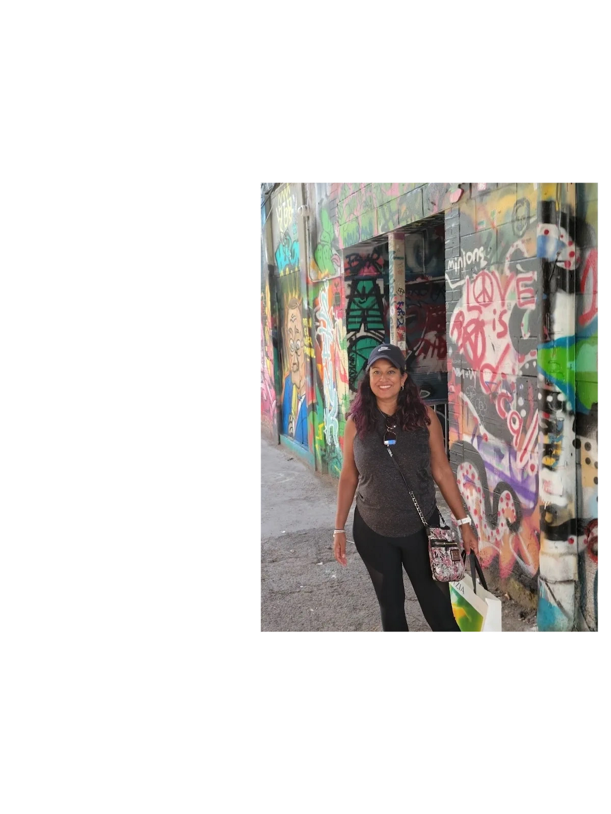 Priti walking in graffiti alley in Toronto in the summer. Paint it Priti out and about.