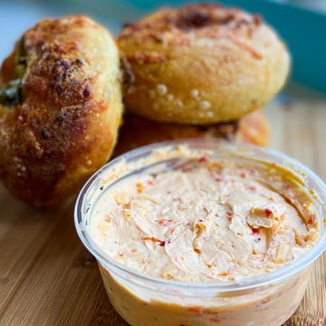 Cream cheese spread with bread rolls.