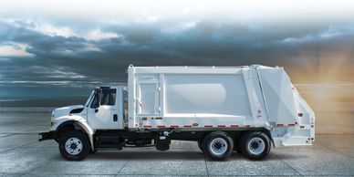 White rear end loader garbage truck . waste insurance.  