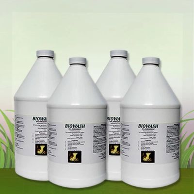 Four large white bottles of Biowash cleaning solution.