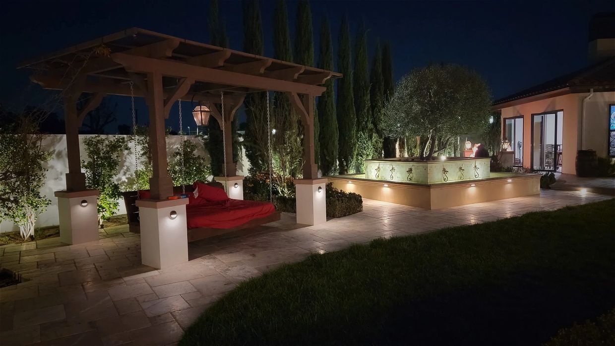 Daybed pergola on columns Elite water fountain and Pavilion with low voltage lighting at night