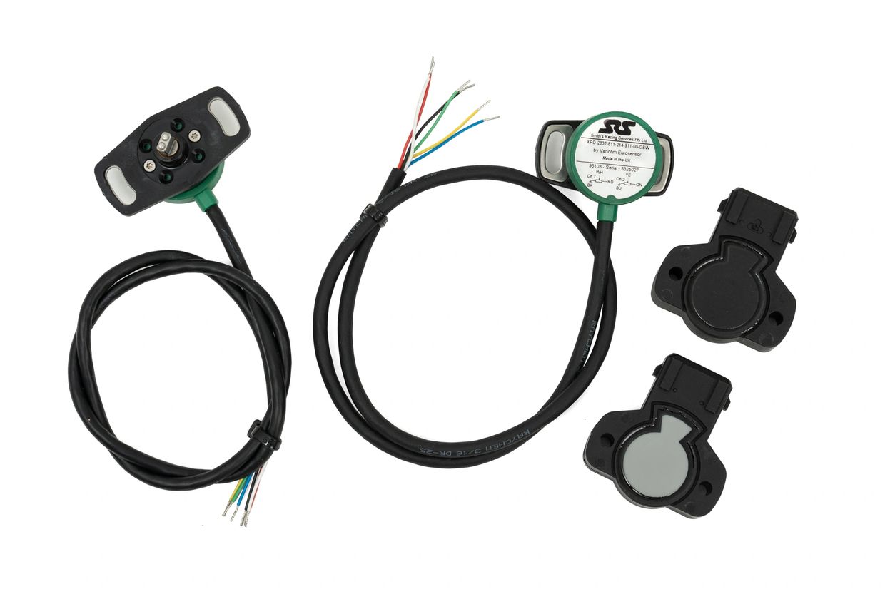 Set of automotive throttle position sensors with wiring harnesses.