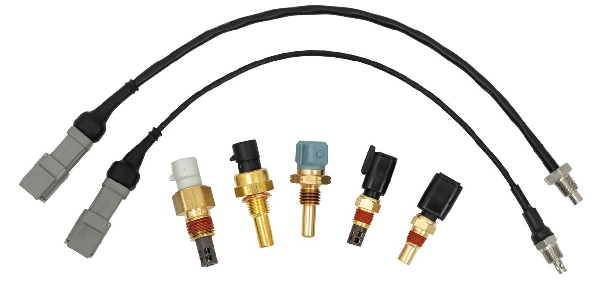 Various automotive temperature sensors and connectors arranged in a row.