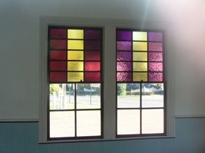 Restored rare double-hung historic windows with colored fifteen over clear four light glass, Wycombe